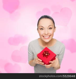 celebration, holidays and happiness concept - smiling asian woman with red gift box