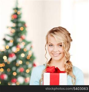 celebration, holidays, xmas concept - happy woman with gift box