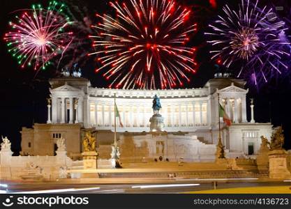 Celebratory fireworks over a monument of Vittoriano. Italy. Rome.