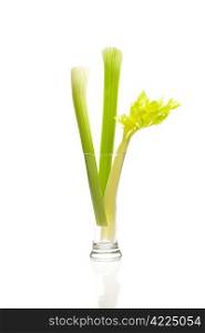 celery in a tall glass isolated on white