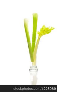 celery in a tall glass isolated on white