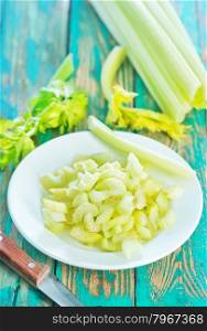 celery on plate and on a table