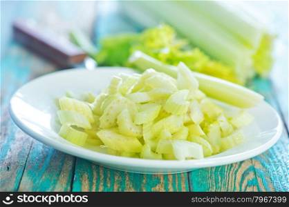 celery on plate and on a table