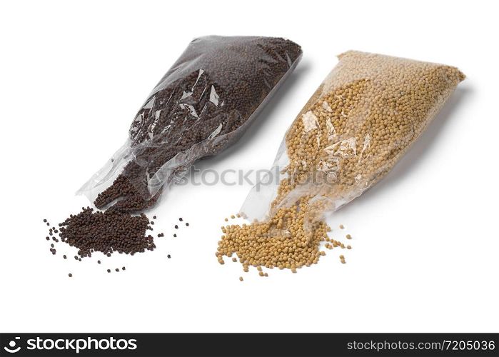 Cellophane bags with yellow and brown mustard seed isolated on white background