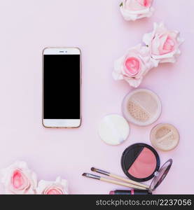 cellphone cosmetics products flower pink background pink background