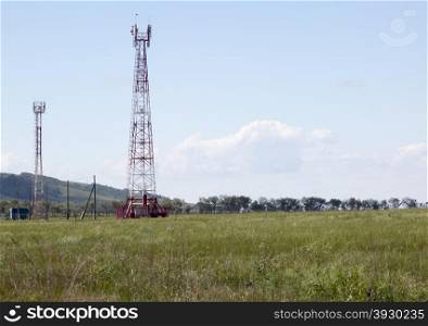 Cellular tower in sunny summer day. Cellular gsm tower in sunny summer day