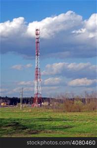 Cellular tower on a background of spring landscape
