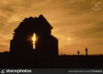 Celtic crosses at sunset in a cemetery, County Clare, Republic of Ireland