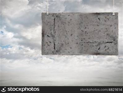 Cement banner. Cement blank hanging banner. Place for text