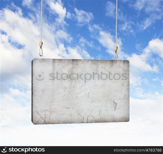 Cement banner. Image of cement blank banner hanging on ropes