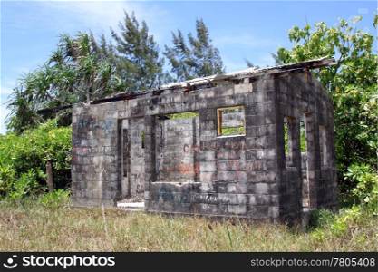 Cement block building with no roof and trees in Efate, Vanuatu