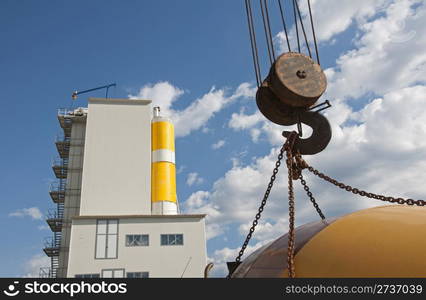 Cement Factory on blue sky background and Lifting hook