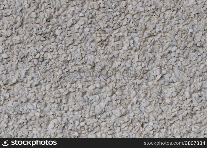 Cement mixed small gravel stone wall or floor texture background