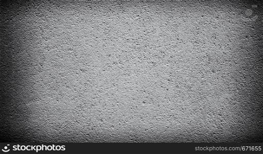 Cement or concrete wall background with darkened edges. Deep focus. Mock up or template. Dark corners. Cement or concrete wall background
