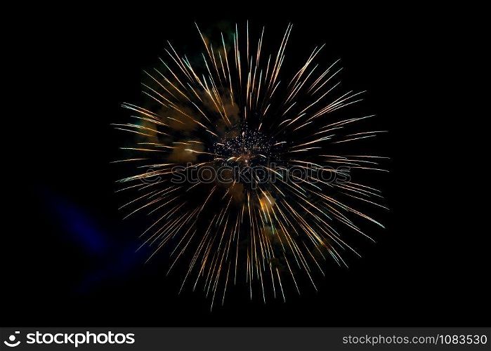 Center Yellow Sparkling Fireworks Background on Night Scene. Abstract color fireworks background and smoke on sky