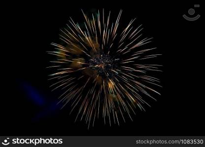 Center Yellow Sparkling Fireworks Background on Night Scene. Abstract color fireworks background and smoke on sky