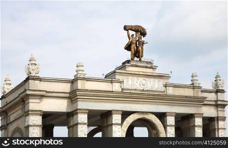 central arch with sculpture of Russian workman and workwoman, focus point on center part