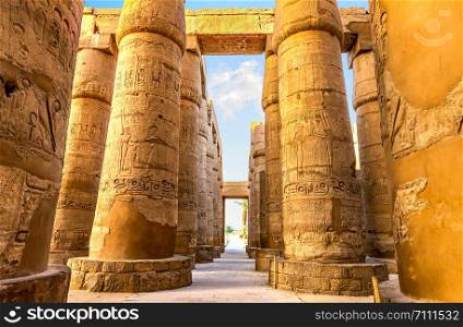 Central colonnade of Karnak temple in Luxor at sunrise, Egypt. Central colonnade of Karnak