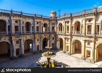 Central square of the inside medieval Templar castle in Tomar in a beautiful summer day, Portugal