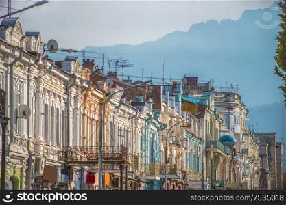 central street of Vladikavkaz on a background of mountains