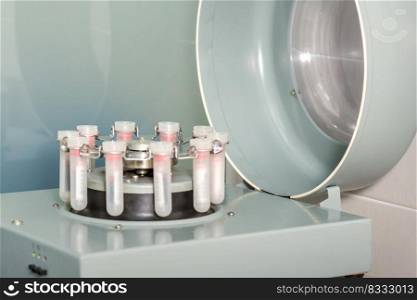 Centrifuge machine with the blood test tubes in the medical laboratory. Centrifuge machine with blood test tubes