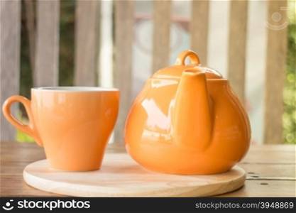 Ceramic cup of tea and teapot, stock photo