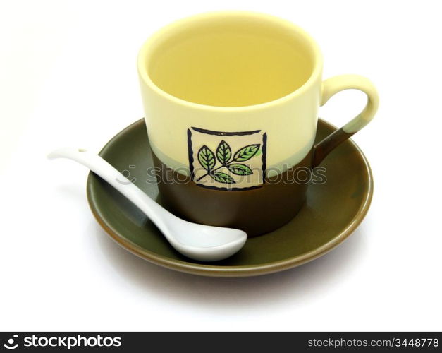 Ceramic cup on a saucer with drawing on a white background