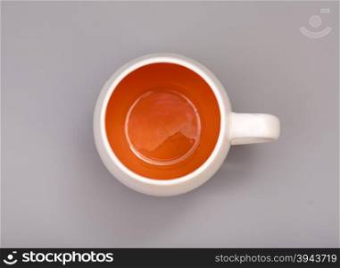 Ceramic cup on gray background