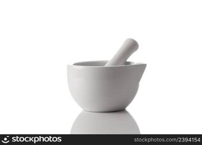 Ceramic mortar and pestle isolated on a white background