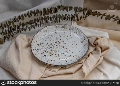 Ceramic Plates with Dried flowers on Calico. Ceramic tableware, Beautiful arrangement.