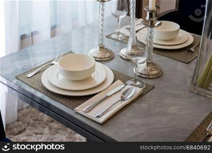 Ceramic tableware on the marble worktop