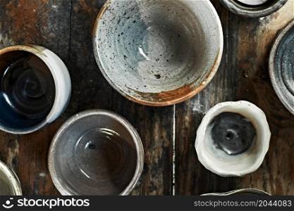 Ceramic tableware on wooden background, top view. Ceramic tableware on wooden background