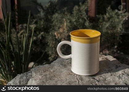 Ceramic tea mug closeup on stone surface closeup