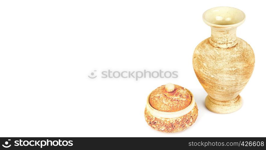 Ceramic vase for flowers and small vase for sweets isolated on white background. Decor items. Free space for text. Wide photo .