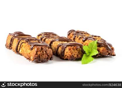 Cereal bars with peanuts and chocolate isolated on white background.