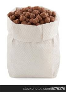 cereal chocolate balls in paper bag isolated on white background