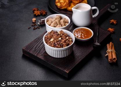 Cereal with chocolate, milk and bread in an egg against a dark concrete background. Delicious nourishing breakfast. Cereal with chocolate, milk and bread in an egg against a dark concrete background