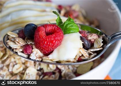 Cereal with yogurt and fruits on wood.. Cereal with yogurt and fruits on wood