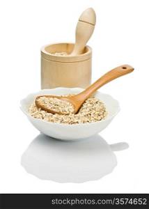 cereals in dish with spoon and mortar