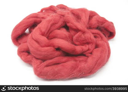 Cerise red piece of Australian sheep wool Merinos breed close-up on a white background. Cerise red piece of Australian sheep wool Merinos breed close-up on a white background.