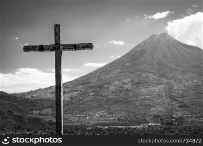 Cerro de la Cruz lookout above the tourist town of Antigua, Guatemala with volcano behind in stunning black and white