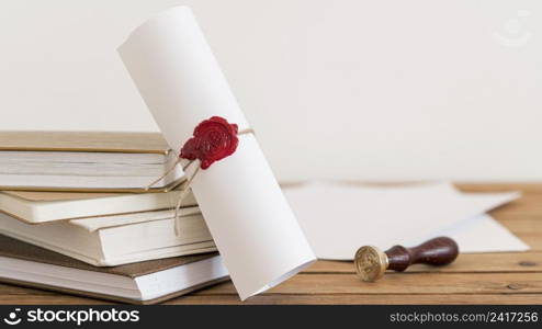 certificate with ribbon bow office desk