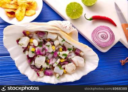 Ceviche peruvian recipe with fried banana and ingredients on wooden blue table