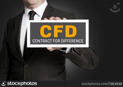 CFD sign is held by businessman.. CFD sign is held by businessman