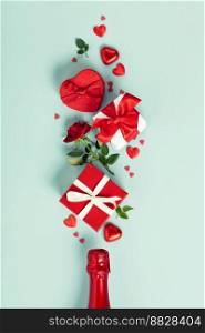 Ch&agne bottle with gift boxes, roses, chocolate and red hearts on blue background, top view, flat lay. Valentine’s day and party concept