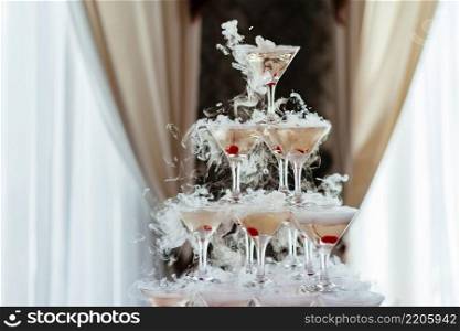 Ch&agne glass pyramid. Pyramid of glasses of wine, ch&agne, tower of ch&agne on wedding party. For festive reception at the wedding on table