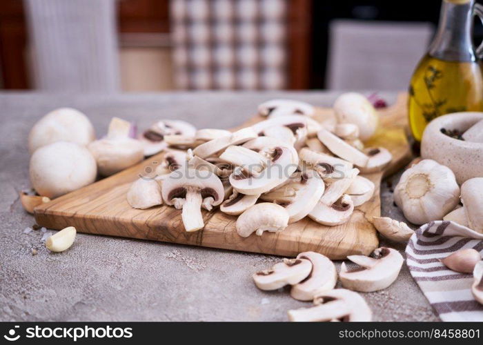 ch&ignon mushrooms on wooden cutting board at domestic kitchen.. ch&ignon mushrooms on wooden cutting board at domestic kitchen