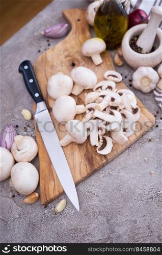 ch&ignon mushrooms on wooden cutting board at domestic kitchen.. ch&ignon mushrooms on wooden cutting board at domestic kitchen