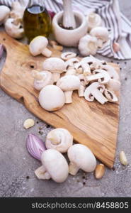 ch&ignon mushrooms on wooden cutting board at domestic kitchen.. ch&ignon mushrooms on wooden cutting board at domestic kitchen