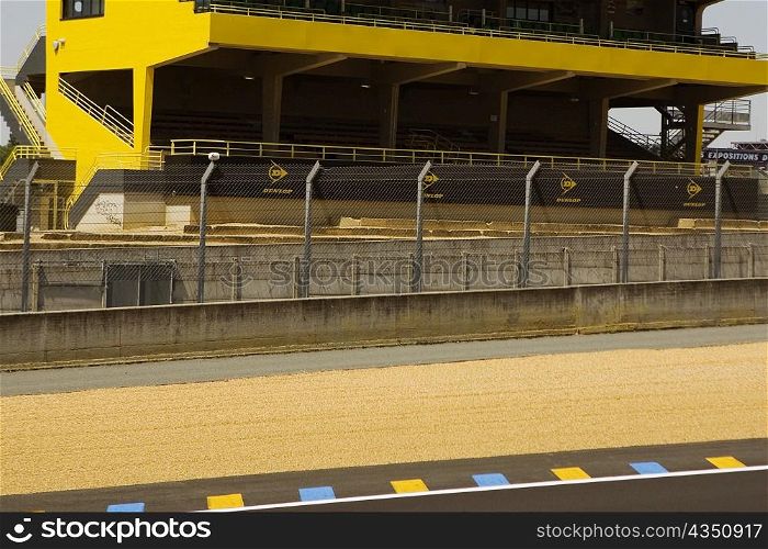 Chain-link fence along with motor racing track, Le Mans, France